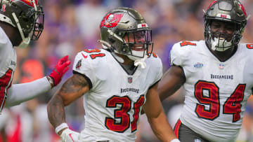 Sep 10, 2023; Minneapolis, Minnesota, USA; Tampa Bay Buccaneers safety Antoine Winfield Jr. (31) celebrates his fumble recovery with defensive tackle Calijah Kancey (94) against the Minnesota Vikings in the first quarter at U.S. Bank Stadium. Mandatory Credit: Brad Rempel-USA TODAY Sports