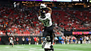 Aug 23, 2024; Atlanta, Georgia, USA; Jacksonville Jaguars tight end Evan Engram (17) catches a touchdown pass past Atlanta Falcons cornerback Anthony Johnson (43) in the second quarter at Mercedes-Benz Stadium. Mandatory Credit: Brett Davis-Imagn Images