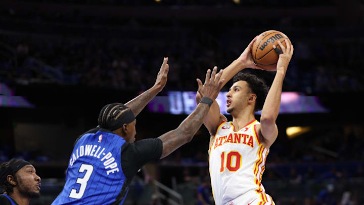 Apr 15, 2025; Orlando, Florida, USA; Atlanta Hawks forward Zaccharie Risacher (10) drives to the basket past Orlando Magic guard Kentavious Caldwell-Pope (3) in the first quarter at Kia Center. Mandatory Credit: Nathan Ray Seebeck-Imagn Images Apr 15, 2025; Orlando, Florida, USA; Atlanta Hawks forward Zaccharie Risacher (10) drives to the basket past Orlando Magic guard Kentavious Caldwell-Pope (3) in the first quarter at Kia Center. Mandatory Credit: Nathan Ray Seebeck-Imagn Images