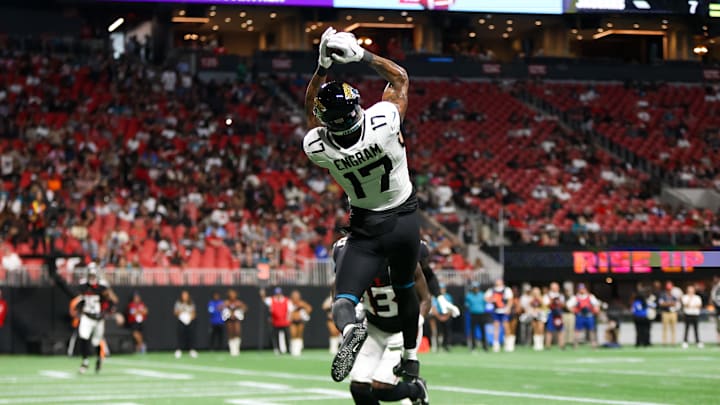 Aug 23, 2024; Atlanta, Georgia, USA; Jacksonville Jaguars tight end Evan Engram (17) catches a touchdown pass past Atlanta Falcons cornerback Anthony Johnson (43) in the second quarter at Mercedes-Benz Stadium. Mandatory Credit: Brett Davis-Imagn Images