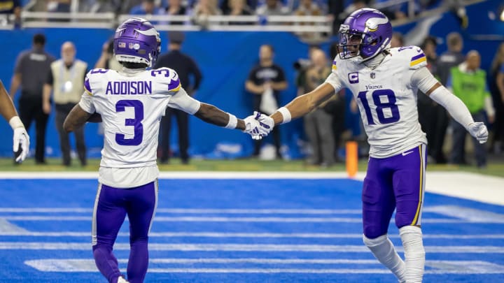 Jan 7, 2024; Detroit, Michigan, USA; Minnesota Vikings wide receiver Jordan Addison (3) catches a pass for a touchdown and celebrates with wide receiver Justin Jefferson (18) during second half of the game against the Detroit Lions at Ford Field.