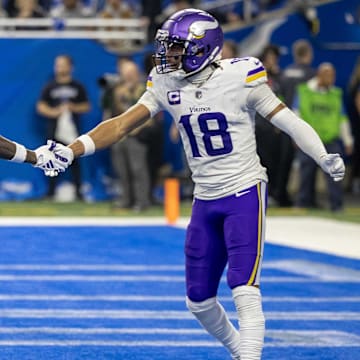 Jan 7, 2024; Detroit, Michigan, USA; Minnesota Vikings wide receiver Jordan Addison (3) catches a pass for a touchdown and celebrates with wide receiver Justin Jefferson (18) during second half of the game against the Detroit Lions at Ford Field.