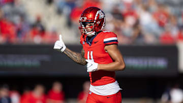 Nov 30, 2024; Tucson, Arizona, USA; Arizona Wildcats wide receiver Tetairoa McMillan (4) against the Arizona State Sun Devils during the Territorial Cup at Arizona Stadium. Mandatory Credit: Mark J. Rebilas-Imagn Images