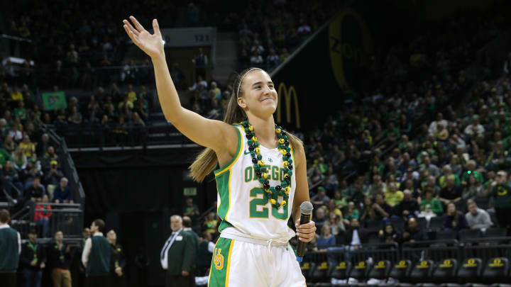 Oregon's Sabrina Ionescu waves to the sold out crowd during the post game program for seniors after the end of the regular season.