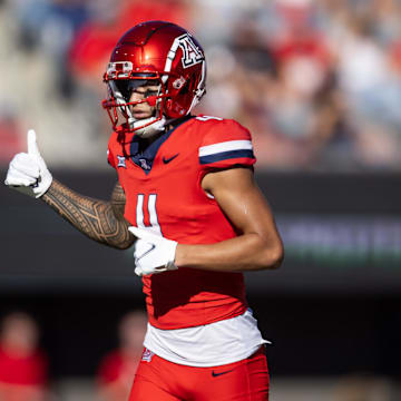 Nov 30, 2024; Tucson, Arizona, USA; Arizona Wildcats wide receiver Tetairoa McMillan (4) against the Arizona State Sun Devils during the Territorial Cup at Arizona Stadium. Mandatory Credit: Mark J. Rebilas-Imagn Images