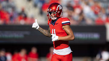 Nov 30, 2024; Tucson, Arizona, USA; Arizona Wildcats wide receiver Tetairoa McMillan (4) against the Arizona State Sun Devils during the Territorial Cup at Arizona Stadium. Mandatory Credit: Mark J. Rebilas-Imagn Images