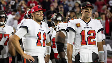 Dec 25, 2022; Glendale, Arizona, USA; Tampa Bay Buccaneers quarterback Blaine Gabbert (11) and Tom Brady (12) against the Arizona Cardinals at State Farm Stadium. Mandatory Credit: Mark J. Rebilas-Imagn Images