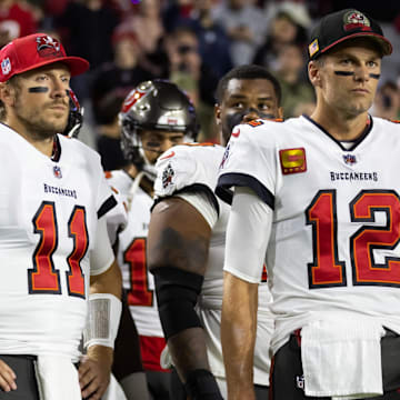Dec 25, 2022; Glendale, Arizona, USA; Tampa Bay Buccaneers quarterback Blaine Gabbert (11) and Tom Brady (12) against the Arizona Cardinals at State Farm Stadium. Mandatory Credit: Mark J. Rebilas-Imagn Images