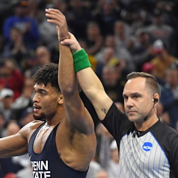 Penn State wrestler Carter Starocci celebrates winning his fifth straight NCAA wrestling title at the 2025 NCAA Wrestling Championships in Philadelphia. 