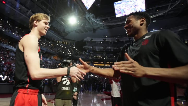 Mar 15, 2024; Toronto, Ontario, CAN; Toronto Raptors guard Gradey Dick (left) and guard Ochai Agbaji (right) during player introductions before a game against the Orlando Magic at Scotiabank Arena. Mandatory Credit: John E. Sokolowski-USA TODAY Sports