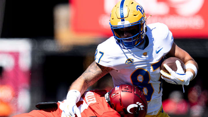 Cincinnati Bearcats' Mehki Miller (20) tackles Pittsburgh Panthers tight end Jake Overman (87) in the fourth quarter of the College Football game at Nippert Stadium in Cincinnati on Saturday, Sept. 7, 2024.