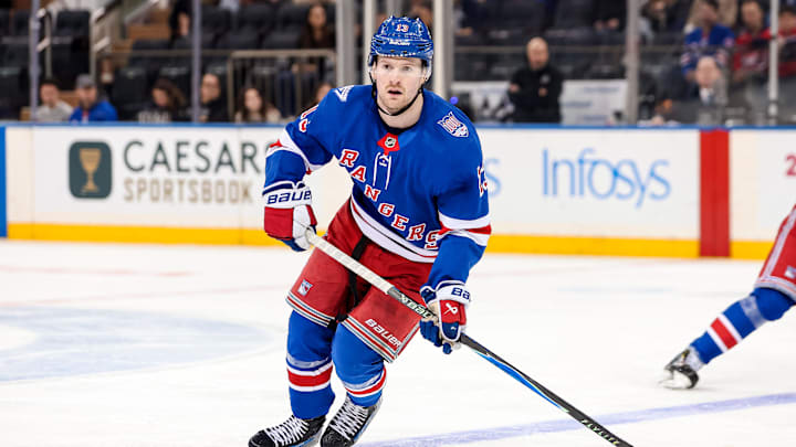 Apr 5, 2026; New York, New York, USA; New York Rangers left wing Alexis Lafreniere (13) skates against the Washington Capitals during the second period at Madison Square Garden. 