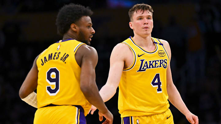Mar 20, 2025; Los Angeles, California, USA; Los Angeles Lakers guard Dalton Knecht (4) fives guard Bronny James (9) after scoring against the Milwaukee Bucks during the second half at Crypto.com Arena. Mandatory Credit: Jonathan Hui-Imagn Images