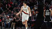 Oct 10, 2025; Portland, Oregon, USA: Portland Trail Blazers center Yang Hansen  (16) reacts after not getting a foul against Sacramento Kings in the second half at Moda Center. Mandatory Credit: Jaime Valdez-Imagn Images