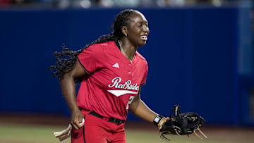 May 29, 2025; Oklahoma City, OK, USA;  Texas Tech Red Raiders pitcher NiJaree Canady (24) smiles as she heads to the dugout in the sixth inning against the Ole Miss Rebels during the NCAA Softball Women's College World Series at Devon Park. Mandatory Credit: Brett Rojo-Imagn Images