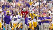 Sep 7, 2024; Baton Rouge, Louisiana, USA;  LSU Tigers wide receiver Shelton Sampson Jr. (6) catches a pass but is pushed out of bounds but Nicholls State Colonels defensive back Malik Woodery (21) during the first half at Tiger Stadium. Mandatory Credit: Stephen Lew-Imagn Images