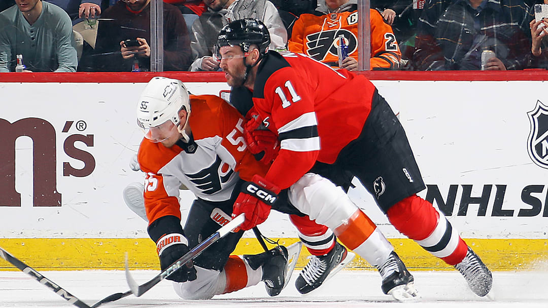 Stefan Noesen (Devils #11) wrestling Rasmus Ristolainen (Flyers #55)