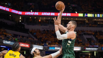 May 2, 2024; Indianapolis, Indiana, USA; Milwaukee Bucks center Brook Lopez (11) shoots the ball while Indiana Pacers guard Andrew Nembhard (2) defends during game six of the first round for the 2024 NBA playoffs at Gainbridge Fieldhouse. 