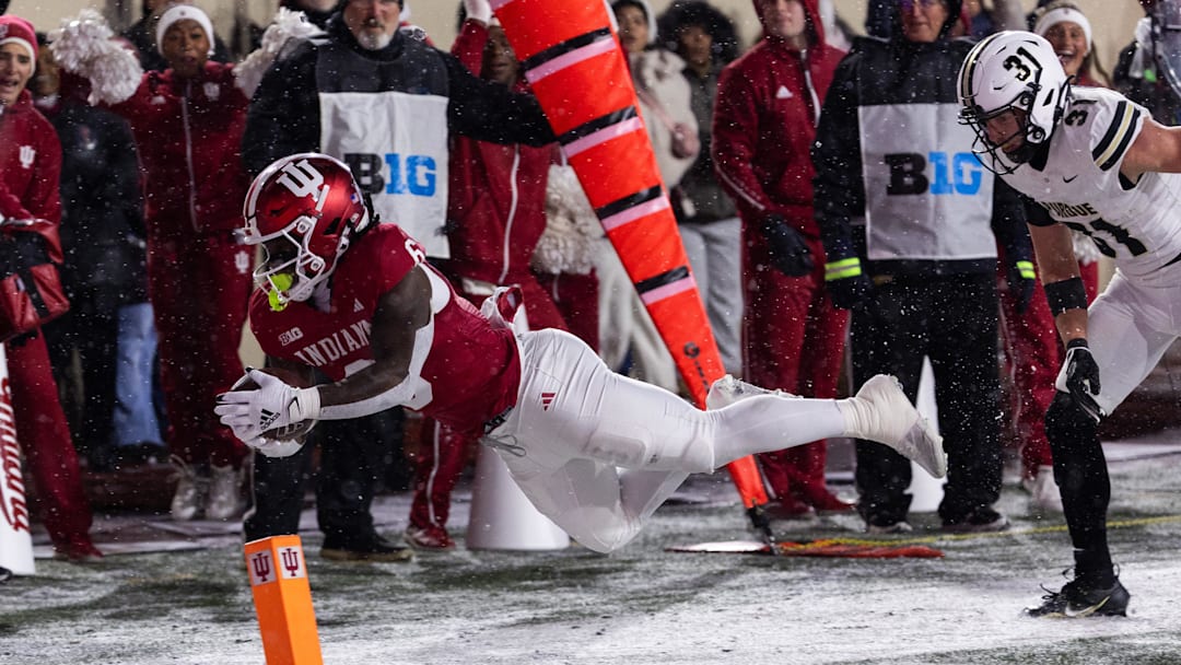 Indiana running back Justice Ellison (6) runs the ball while Purdue defensive back Dillon Thieneman (31) defends in the first quarter at Memorial Stadium. 