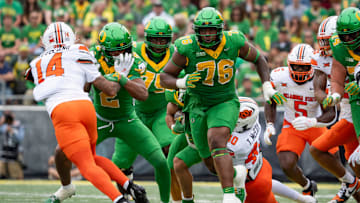 Oregon offensive lineman Isaiah World clears a path as the Oregon Ducks host the Oklahoma State Cowboys on Sept. 6, 2025, at Autzen Stadium in Eugene, Oregon.