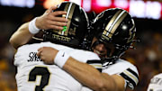 Purdue Boilermakers quarterback Malachi Singleton (3) and quarterback Ryan Browne (15) celebrate after a touchdown 