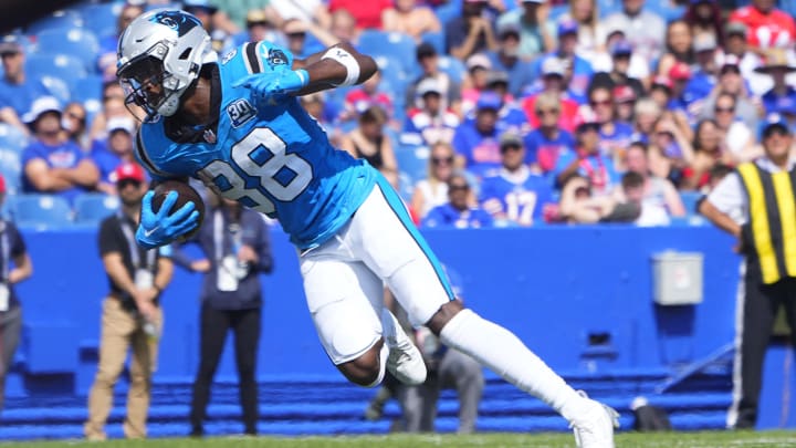 Aug 24, 2024; Orchard Park, New York, USA; Carolina Panthers wide receiver Terrace Marshall Jr. (88) runs with the ball after making a catch and scores a touchdown against the Buffalo Bills during the second half at Highmark Stadium. 