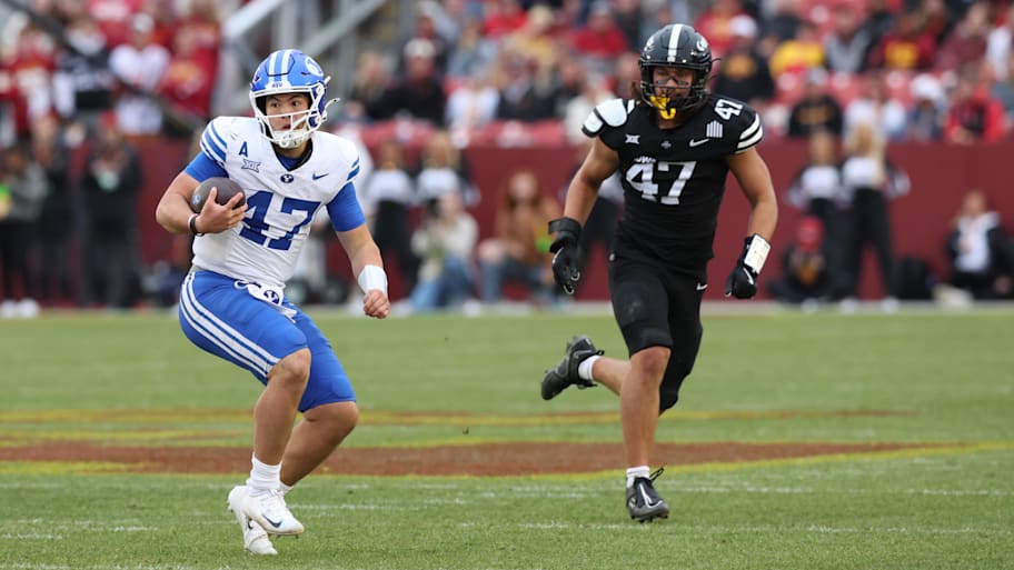 BYU Cougars quarterback Bear Bachmeier runs the football against the Iowa State Cyclones.