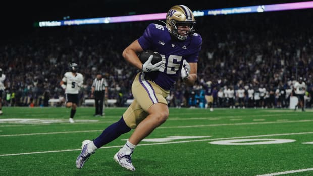 Freshman Decker DeGraaf has no one around him as he scores on a 33-yard touchdown pass on his first Husky play. 