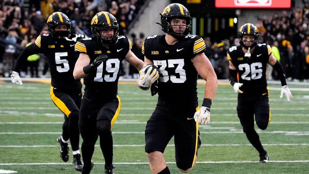 Iowa Hawkeyes linebacker Cam Buffington (33) runs the ball after intercepting a pass during a game against the Minnesota Golden Gophers Oct. 25, 2025 at Kinnick Stadium in Iowa City, Iowa.