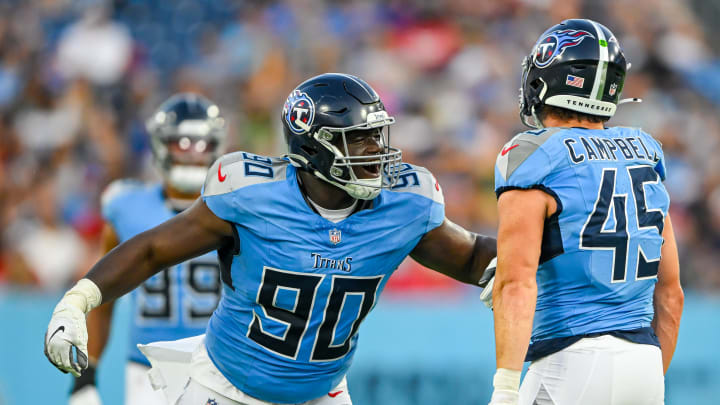 Aug 10, 2024; Nashville, Tennessee, USA; Tennessee Titans linebacker Chance Campbell (45) and defensive tackle Marlon Davidson (90) celebrate the sack against the San Francisco 49ers during the first half during the first half at Nissan Stadium