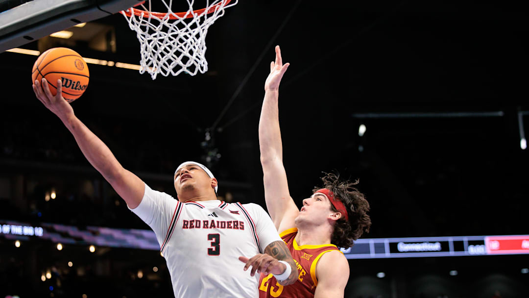 Mar 12, 2026; Kansas City, MO, USA; Texas Tech Red Raiders forward LeJuan Watts (3) shoots the ball around Iowa State Cyclones forward Blake Buchanan (23) during the first half at T-Mobile Center. Mandatory Credit: William Purnell-Imagn Images