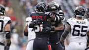Nov 9, 2025; Houston, Texas, USA; Houston Texans defensive end Danielle Hunter (55) and defensive end Will Anderson Jr. (51) celebrate after a sack during the game against the Jacksonville Jaguars at NRG Stadium. Mandatory Credit: Troy Taormina-Imagn Images