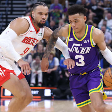 Apr 11, 2024; Salt Lake City, Utah, USA; Utah Jazz guard Keyonte George (3) drives against Houston Rockets forward Dillon Brooks (9) during the second quarter at Delta Center. Mandatory Credit: Rob Gray-Imagn Images