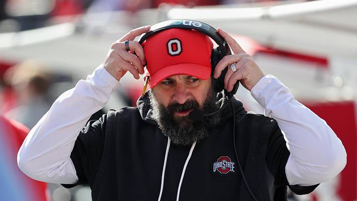 Nov 22, 2025; Columbus, Ohio, USA; Ohio State Buckeyes defensive coordinator Matt Patricia puts on his headset before the game against the Rutgers Scarlet Knights at Ohio Stadium. Mandatory Credit: Joseph Maiorana-Imagn Images