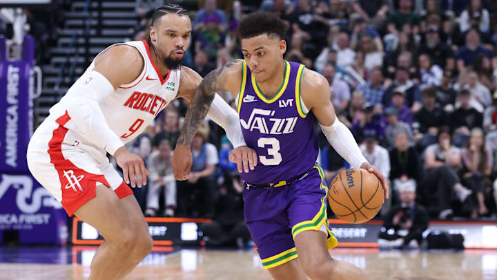 Apr 11, 2024; Salt Lake City, Utah, USA; Utah Jazz guard Keyonte George (3) drives against Houston Rockets forward Dillon Brooks (9) during the second quarter at Delta Center. Mandatory Credit: Rob Gray-Imagn Images