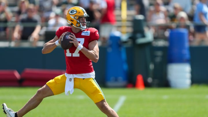 Green Bay Packers quarterback Michael Pratt (17) runs through a drill at training camp on Wednesday.