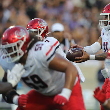 Arizona Wildcats quarterback Noah Fifita (11) hikes the ball during the first quarter of the game against Kansas State at Bill Snyder Family Stadium on Friday, September 13, 2024.