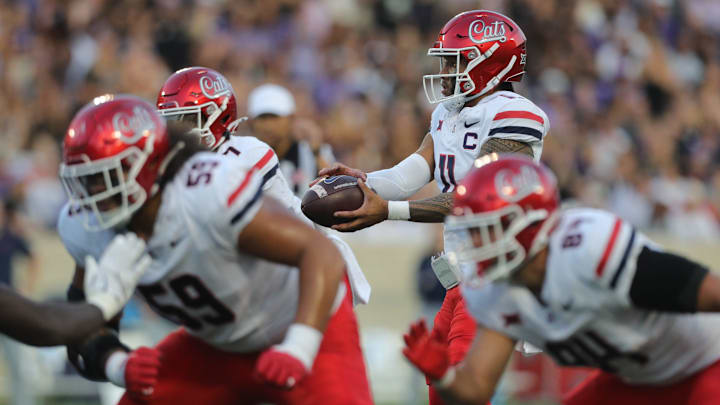 Arizona Wildcats quarterback Noah Fifita (11) hikes the ball during the first quarter of the game against Kansas State at Bill Snyder Family Stadium on Friday, September 13, 2024.