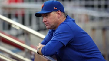 Sep 24, 2024; Atlanta, Georgia, USA; New York Mets manager Carlos Mendoza (64) in the dugout before a game against the Atlanta Braves at Truist Park. Mandatory Credit: Brett Davis-Imagn Images