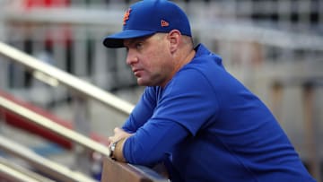 Sep 24, 2024; Atlanta, Georgia, USA; New York Mets manager Carlos Mendoza (64) in the dugout before a game against the Atlanta Braves at Truist Park. Mandatory Credit: Brett Davis-Imagn Images