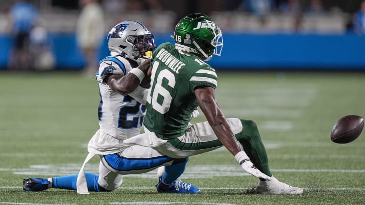 Aug 17, 2024; Charlotte, North Carolina, USA; New York Jets wide receiver Jason Brownlee (16) pass is broken up by Carolina Panthers cornerback D'Shawn Jamison (29) during the second half at Bank of America Stadium. 