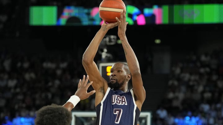 Aug 10, 2024; Paris, France; United States guard Kevin Durant (7) shoots against France power forward Guerschon Yabusele (7) in the first quarter in the men's basketball gold medal game during the Paris 2024 Olympic Summer Games at Accor Arena. Mandatory Credit: Kyle Terada-USA TODAY Sports