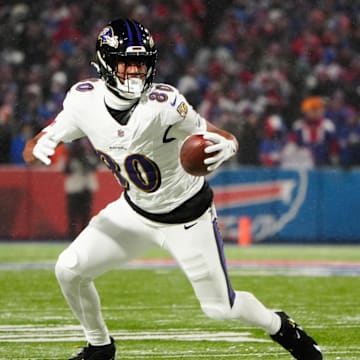 Jan 19, 2025; Orchard Park, New York, USA; Baltimore Ravens tight end Isaiah Likely (80) runs the ball after making a catch during the first quarter against the Buffalo Bills in a 2025 AFC divisional round game at Highmark Stadium. Mandatory Credit: Gregory Fisher-Imagn Images
