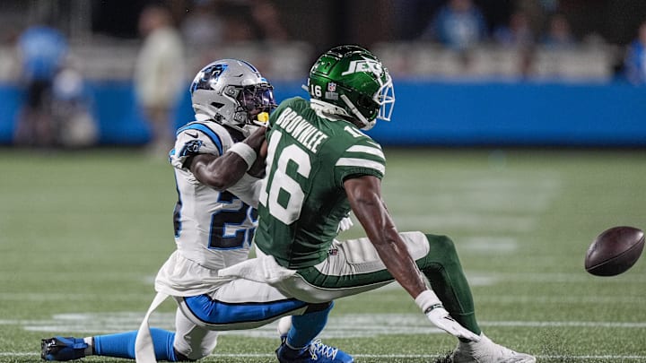 Aug 17, 2024; Charlotte, North Carolina, USA; New York Jets wide receiver Jason Brownlee (16) pass is broken up by Carolina Panthers cornerback D'Shawn Jamison (29) during the second half at Bank of America Stadium.