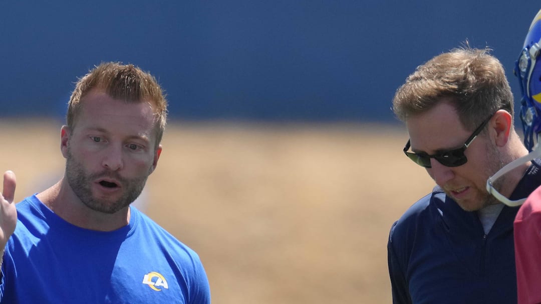 May 23, 2022; Thousand Oaks, CA, USA; Los Angeles Rams coach Sean McVay (left), offensive coordinator Liam Coen (center) and quarterback Matthew Stafford (9) during organized team activities at California Lutheran University. Mandatory Credit: Kirby Lee-Imagn Images