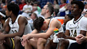 Vanderbilt guard Chris Manon, center, reacts on the bench during a NCAA college basketball first round game against Texas at the men’s Southeastern Conference Tournament Wednesday, March 12, 2025, in Nashville, Tenn. Vanderbilt lost 79-72.