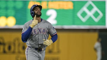 Texas Rangers outfielder Leody Taveras (3) points to the sky after hitting a home run