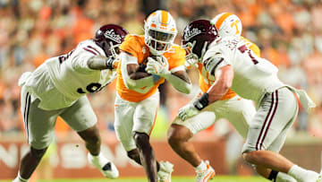 Tennessee running back Dylan Sampson (6) gets tackled by Mississippi State defensive lineman Kai McClendon (90) and Mississippi State linebacker Stone Blanton (7) during a college football game between Tennessee and Mississippi State at Neyland Stadium in Knoxville, Tenn., on Saturday, Nov. 9, 2024.