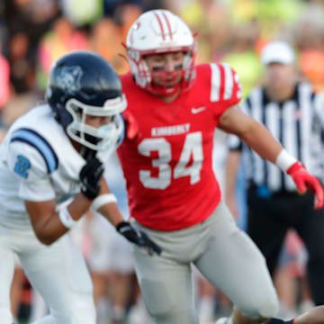 Kimberly High School's Cam Wong (7) looks to pass against Bay Port High School during their football game Thursday, August 28, 2025, in Kimberly, Wisconsin. Kimberly won 23-7.