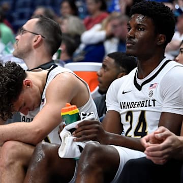 Vanderbilt guard Chris Manon, center, reacts on the bench during a NCAA college basketball first round game against Texas at the men’s Southeastern Conference Tournament Wednesday, March 12, 2025, in Nashville, Tenn. Vanderbilt lost 79-72.